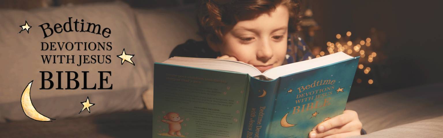 Child reading Bedtime devotions with Jesus Bible