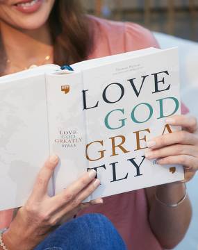 Woman reading NET Love God Greatly Bible