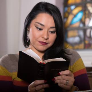Woman reading a KJV Compact Bible